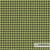 Close-up van Gabriel Go Couture 68153 stof met klassieke pepita-ruitmotieven, gemaakt van milieuvriendelijke Trevira CS. Ideaal voor elegante inrichting.