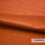 Casal Dolly woontextiel in warme oranje tint, hoog wolgehalte, brandvertragend en slijtvast. Luxe stof voor interieur.