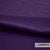 Close-up van Casal Dolly aubergine woontextiel met gevilte oppervlakte en hoge wolgehalte, brandvertragend en slijtvast.
