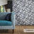 Blauwe Casal Canoas stof met bonsai print in woonkamer interieur