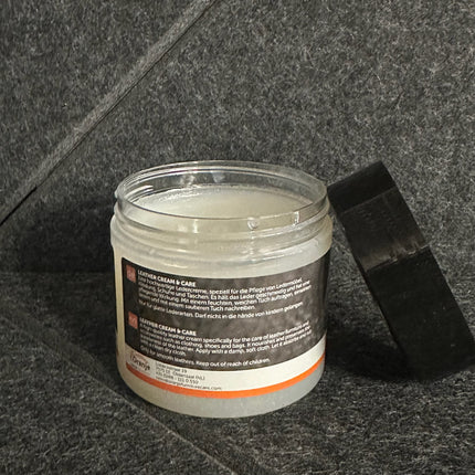 Leather Cream & Care 180 ml jar on a dark textured background