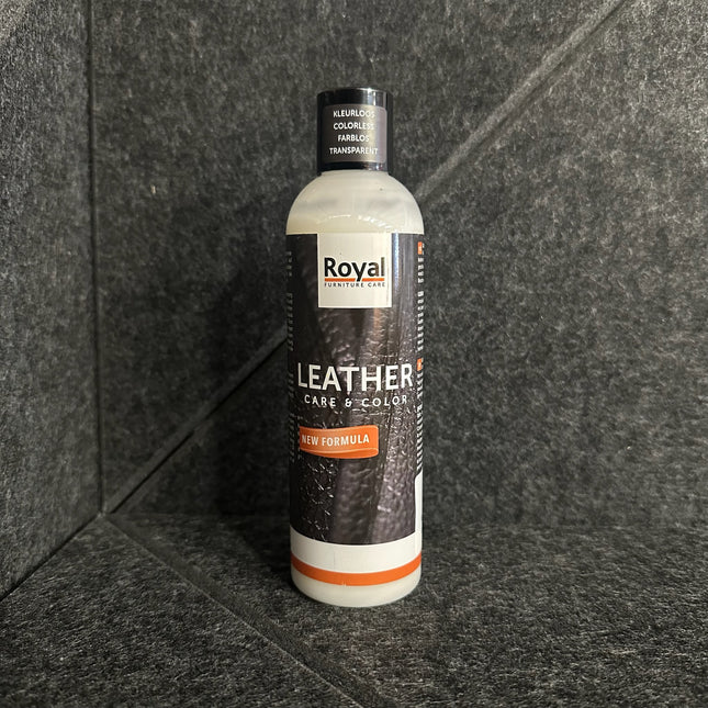 Bottle of Royal Furniture Leather Care & Color Lederwas - 250 ml on a textured background.