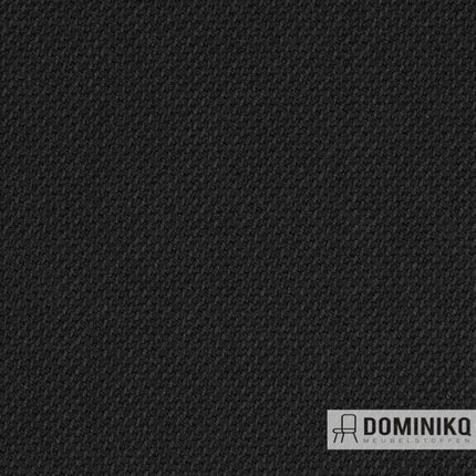 Zwarte wollen bekledingsstof met reliëfstructuur, bekend om elegantie en authentieke uitstraling, perfect voor duurzaam interieurontwerp.