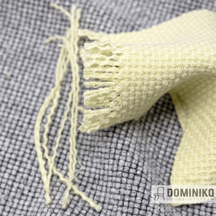 Nobel bekledingsstof van Gabriel in grijze en gele tinten met volumineuze textuur, ideaal voor luxe zitmeubelen.