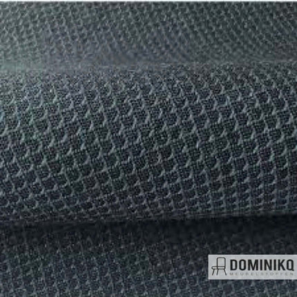 Close-up van de Jaali-stof in donkergrijs met netpatroon, gericht op balans en grafisch ritme door effen gekleurde garens.