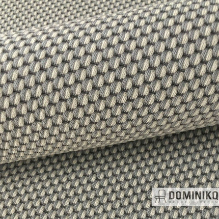 Close-up van Kvadrat - Febrik - Drop 951, gebreide stof met parelachtige textuur in grijstinten, kleurrijke ton-sur-ton combinaties.