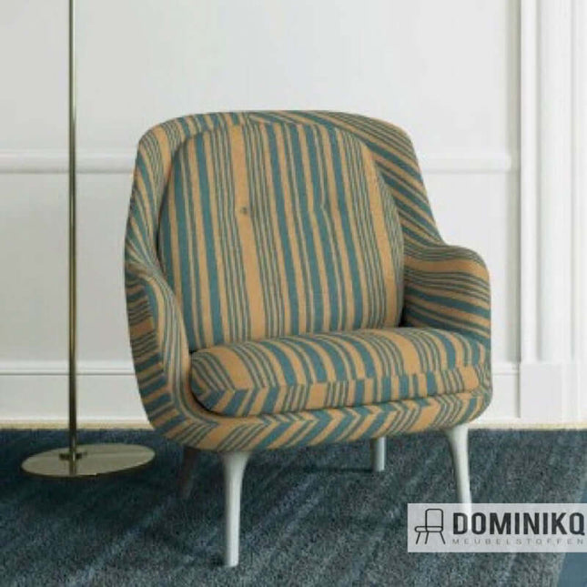 Striped armchair in modern living room setting with floor lamp, showcasing elegant design and comfort