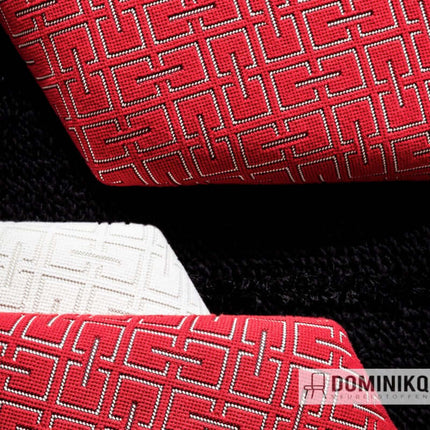 Geometrisch patroonstof in rood en wit van Kvadrat Sahco, ideaal voor grote en kleine oppervlaktes, retro stijl uit jaren zeventig.