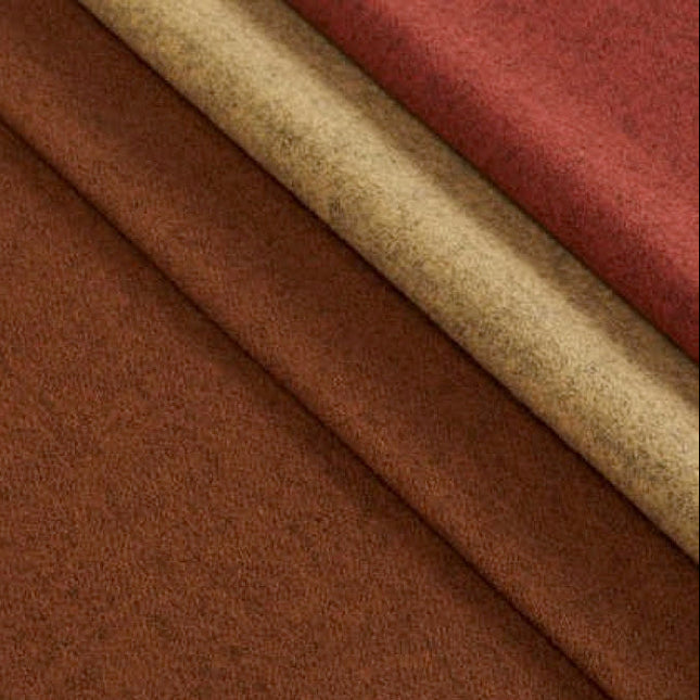 Stoffen uit de Camira Blazer Lite collectie in verschillende kleuren, ideaal voor bureauschermen en panelen, gemaakt van 100% wol.