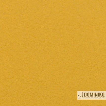 Luxe kunstleer Valencia van Vyva Fabrics in geel squash, textuur detail voor interieurdecoratie, brandveilig en duurzaam.