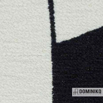 Close-up van Aristide Agape meubelstof in zwart en wit met grafisch patroon en unieke bouclé structuur.