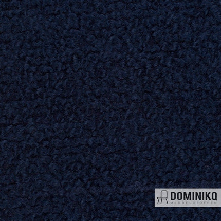 Donkerblauwe Storr CF774 Imperiaal meubelstof van Bute Fabrics, hoogwaardige bouclé met dikke lussen en wolrijke samenstelling.