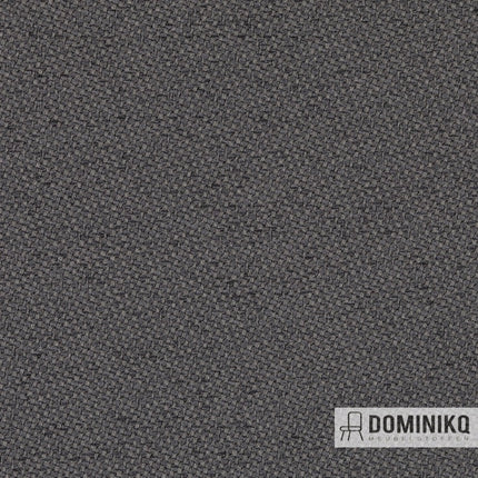 Gabriel Chili stof met tweekleurig patroon en warme afwerking, gedetailleerde weefstructuur van dikke garens met uniek ruitontwerp.