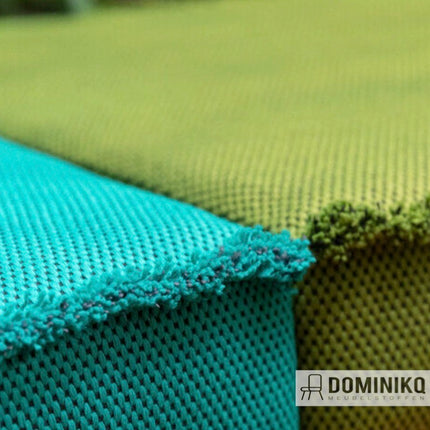 Detail van Vescom Wilson meubelstoffen in blauw en groen, met een matte, zachte textuur en veelzijdige, richtingloze structuur.