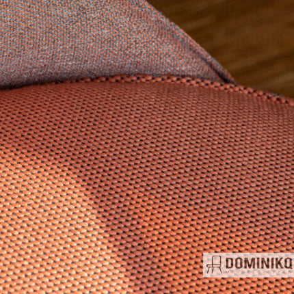 Close-up van Vescom Wilson 7067.08 stof, matte uitstraling met zachte textuur en veelzijdige, richtingloze structuur in warme kleuren.